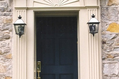 Example of a mid-sized classic entryway design in Philadelphia with a black front door