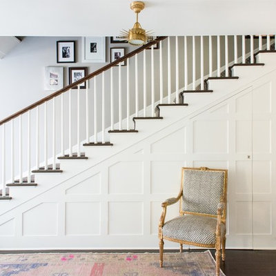 Example of a mid-sized transitional dark wood floor and brown floor entryway design in New York with gray walls