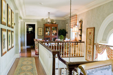 Inspiration for a mid-sized timeless light wood floor entry hall remodel in New York with beige walls