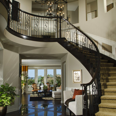 Elegant foyer photo in Denver with beige walls