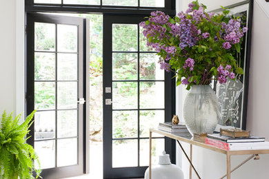 Design ideas for a classic foyer in DC Metro with white walls, marble flooring and multi-coloured floors.