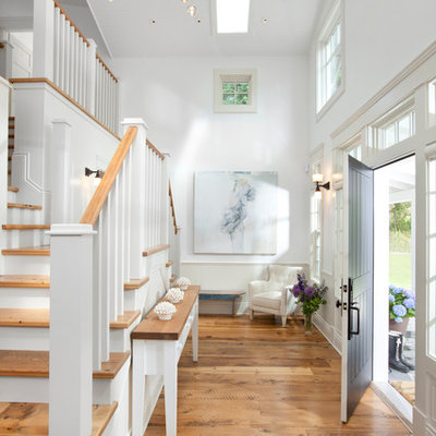 Inspiration for a timeless entryway remodel in Vancouver with a black front door