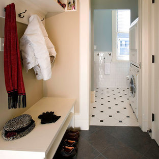 Small elegant slate floor and black floor mudroom photo in Boston with beige walls