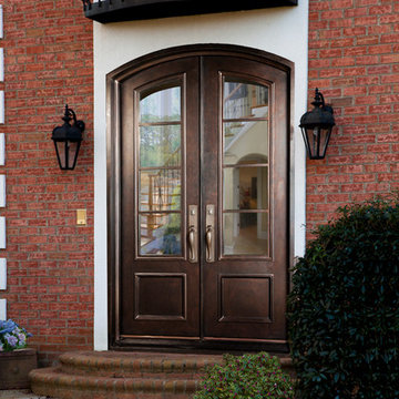 Elevated Traditional Exterior: Wrought Iron Doors