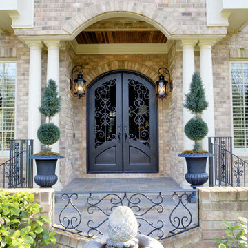 Intricate Iron Door Scrollwork to Complement a Home's Other Architectural Elemen