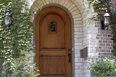 Mid-sized elegant entryway photo in Chicago with a medium wood front door