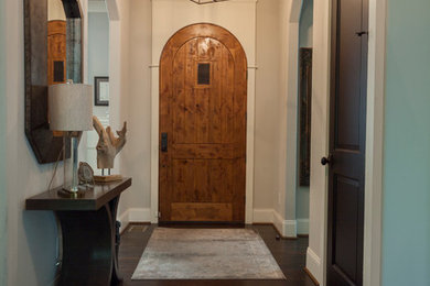 Inspiration for a mid-sized timeless dark wood floor and brown floor entryway remodel in Nashville with gray walls and a dark wood front door