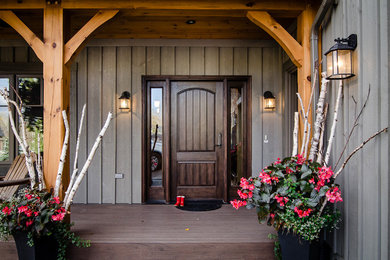 Medium sized rustic front door in Orange County with a single front door and a dark wood front door.
