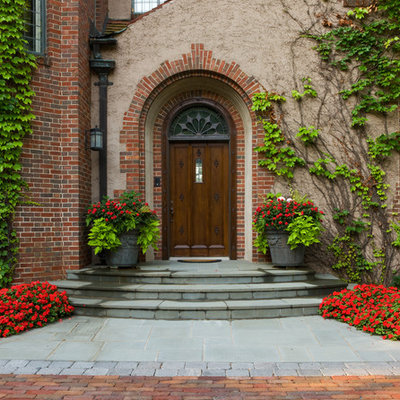 Example of a classic entryway design in Minneapolis with a dark wood front door