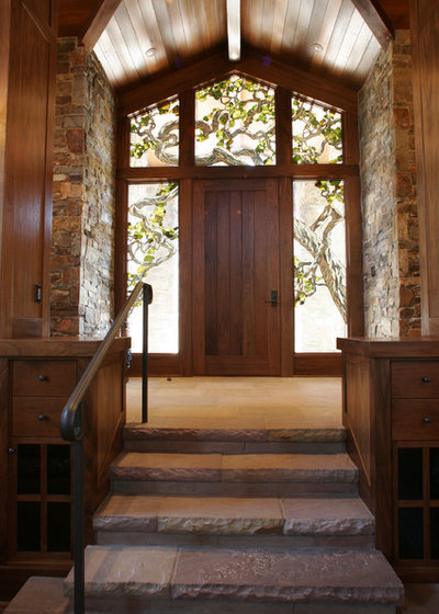 Rustic Entry by Mahoney Architects & Interiors