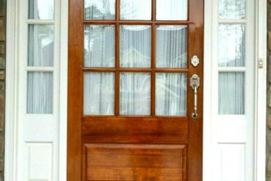 Inspiration for an entryway remodel in Raleigh with a medium wood front door