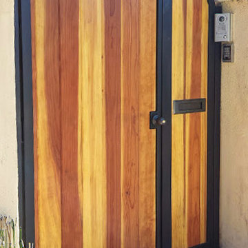 Wood entry gate, iron braced