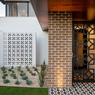 Inspiration for a contemporary front door in Perth with white walls, a single front door, a glass front door and multi-coloured floor.
