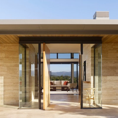 Trendy entryway photo in San Francisco with a light wood front door
