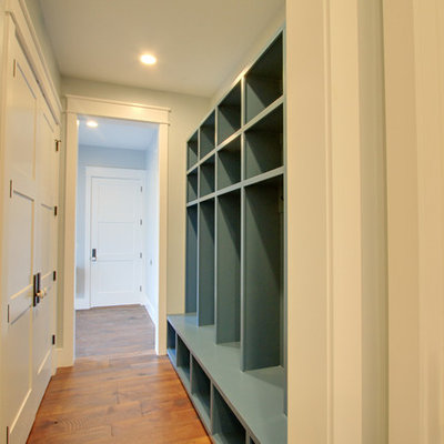 Mudroom - small farmhouse light wood floor mudroom idea in Salt Lake City