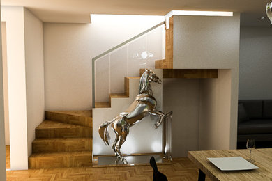 Foto de escalera en U minimalista de tamaño medio con escalones de madera, contrahuellas de madera y barandilla de vidrio