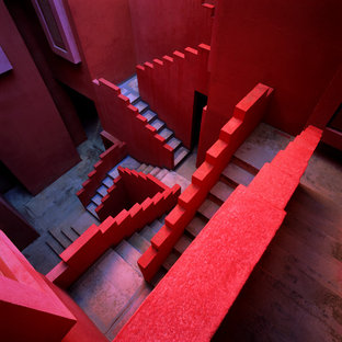 Foto di un'ampia scala a "U" bohémian con pedata in cemento e alzata in cemento