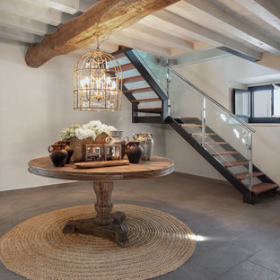 Imagen de escalera en L, tradicional renovada, sin contrahuella, con escalones de madera y barandilla de varios materiales