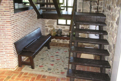 Inspiration for a rustic staircase remodel in Other