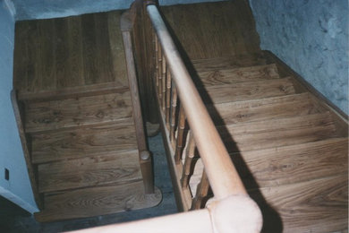 Inspiration pour un escalier traditionnel avec des contremarches en bois et un garde-corps en bois.