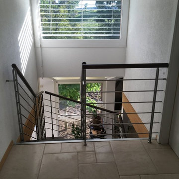 Escalier en bois balustrades en acier sur 2 étages