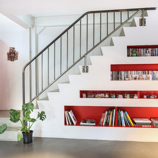 Aménagement d'un escalier contemporain en L de taille moyenne avec des marches en béton et des contremarches en béton.