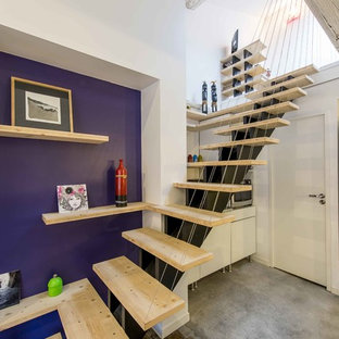 Idée de décoration pour un escalier sans contremarche droit design avec des marches en bois.