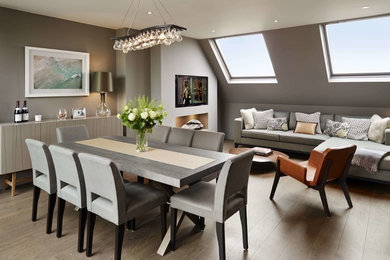 Photo of a medium sized traditional open plan dining room in London with grey walls.
