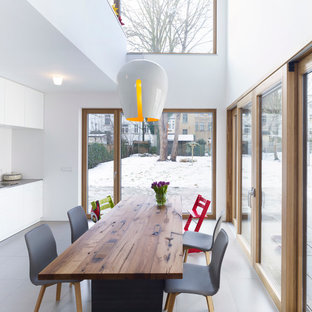 Mid-sized urban dining room photo in Leipzig with white walls and no fireplace