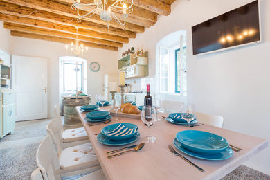 Inspiration for a rustic dining room in Venice.
