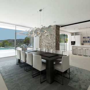 Imagen de comedor de cocina contemporáneo, grande, con paredes rojas y suelo gris