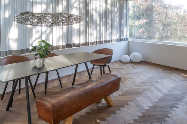 Midcentury Dining Room by INNENRÄUME