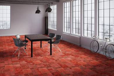 Réalisation d'une salle à manger design avec moquette et un sol rouge.