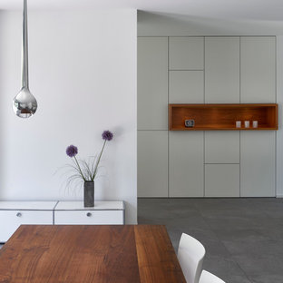 Dining room - modern dining room idea in Other with white walls
