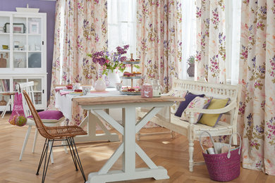 Medium sized farmhouse dining room in Stuttgart with light hardwood flooring.