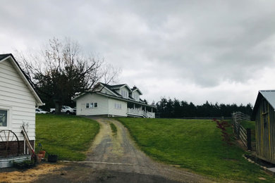 Example of a farmhouse exterior home design in Seattle