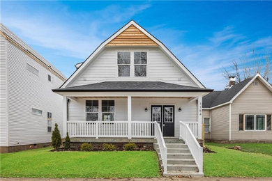 Inspiration for a large and white classic two floor detached house in Indianapolis with vinyl cladding, a shingle roof and a half-hip roof.