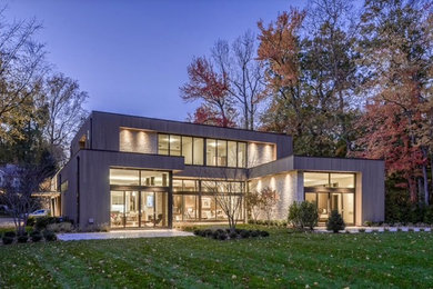 Inspiration for a large modern two-story concrete exterior home remodel in New York