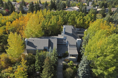 Huge modern blue split-level wood exterior home idea in Calgary
