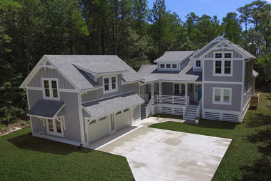 Inspiration for a large coastal two-story exterior home remodel in Other