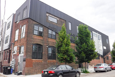 Mid-sized industrial three-story brick apartment exterior idea in Philadelphia