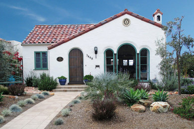 Tuscan white one-story stucco gable roof photo in San Diego