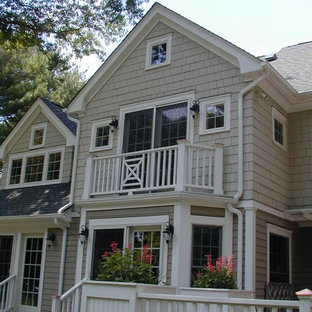 Large elegant gray two-story wood gable roof photo in New York