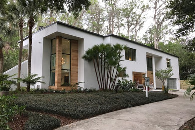 Inspiration for a modern white two-story house exterior remodel in Orlando