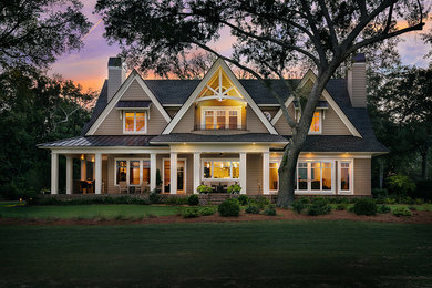 Inspiration for a timeless brown two-story exterior home remodel in Charleston with a shingle roof