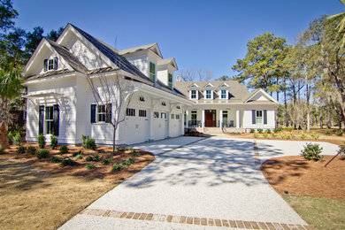 Design ideas for a large and white traditional two floor house exterior in Atlanta with wood cladding.
