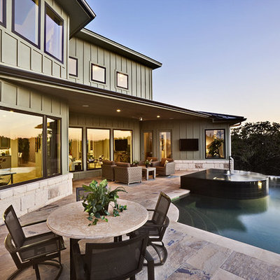 Example of a trendy green exterior home design in Austin