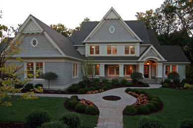 Inspiration for a timeless gray two-story wood exterior home remodel in Minneapolis