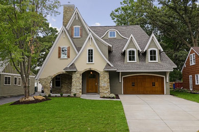 Example of a transitional beige two-story exterior home design in Minneapolis