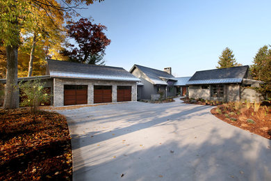 Large transitional gray two-story gable roof photo in Grand Rapids